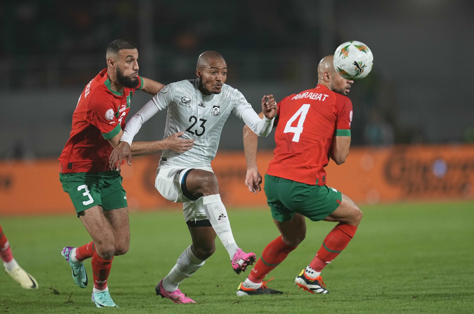 Morocco&#039;s Noussair Mazraoui (L) and South Africa&#039;s Thapelo James Morena (C) battle for the ball during the AFCON round of 16 match at Stade Laurent Pokou, San-Pedro, Ivory Coast, Jan. 30, 2024. (Getty Images Photo)