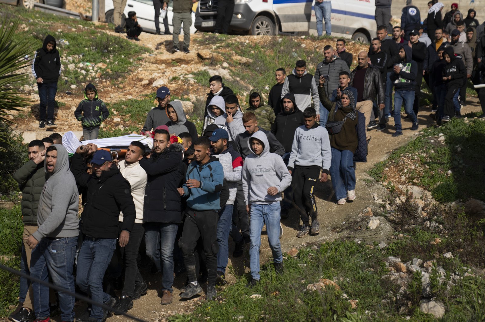 Mourners carry the body of Palestinian Abdel Rahman Hamed, 18, during his funeral in the West Bank town of Silwad, Monday, Jan. 29, 2024. (AP Photo)