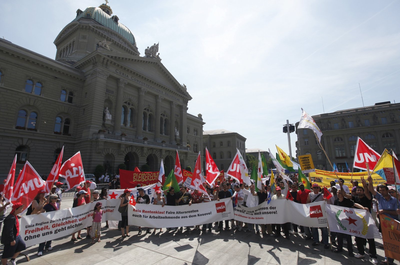 Protesters demonstrate against discrimination, social exclusion and racism on Federal Square in front of the parliament building in Bern, June 26, 2010. (Reuters File Photo)