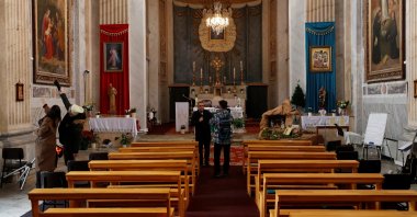 Media members visit the Italian Santa Maria Catholic Church a day after an attack killing one during the Sunday service, in Istanbul, Türkiye, Jan. 29, 2024. (Reuters Photo)