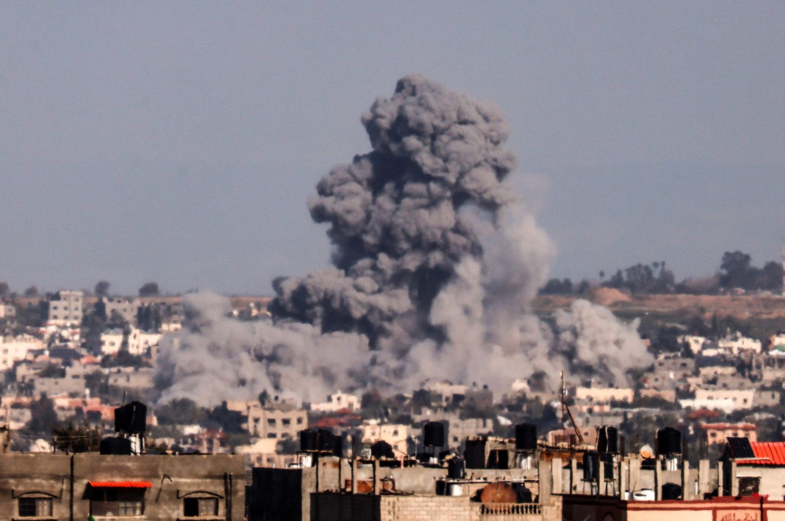 This picture taken from Rafah shows smoke rising over buildings in Khan Yunis during Israeli bombardment, Gaza Strip, Palestine, Feb. 1, 2024. (AFP Photo)