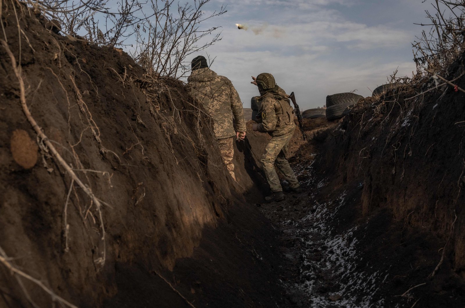 A Ukrainian serviceman of the 22nd Mechanized Brigade throws a grenade during military training amid the Russian invasion of Ukraine, the Donetsk region, Ukraine, Jan. 31, 2024. (AFP Photo)