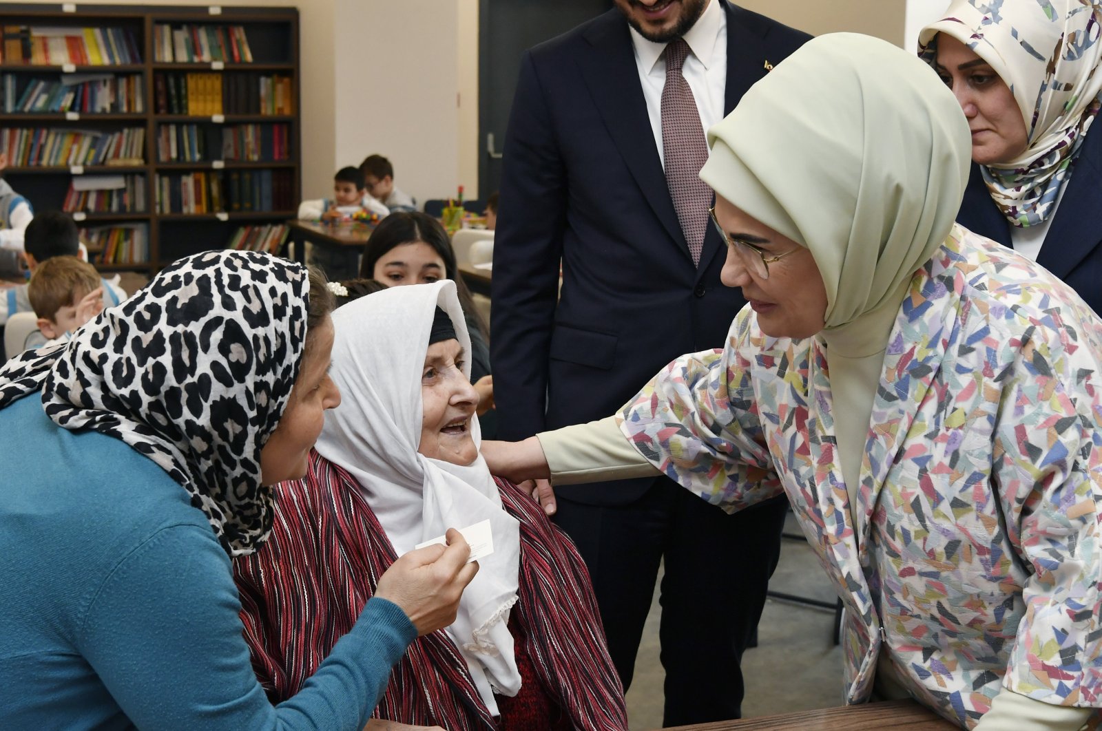 First Lady Emine Erdoğan speaks with an elderly woman at Vefahane senior's complex in Istanbul, Feb. 2, 2024. (AA Photo)