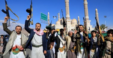 Armed Yemeni demonstrators take to the streets of the Houthi-controlled capital Sanaa, Yemen, Feb. 2, 2024. (AFP Photo)