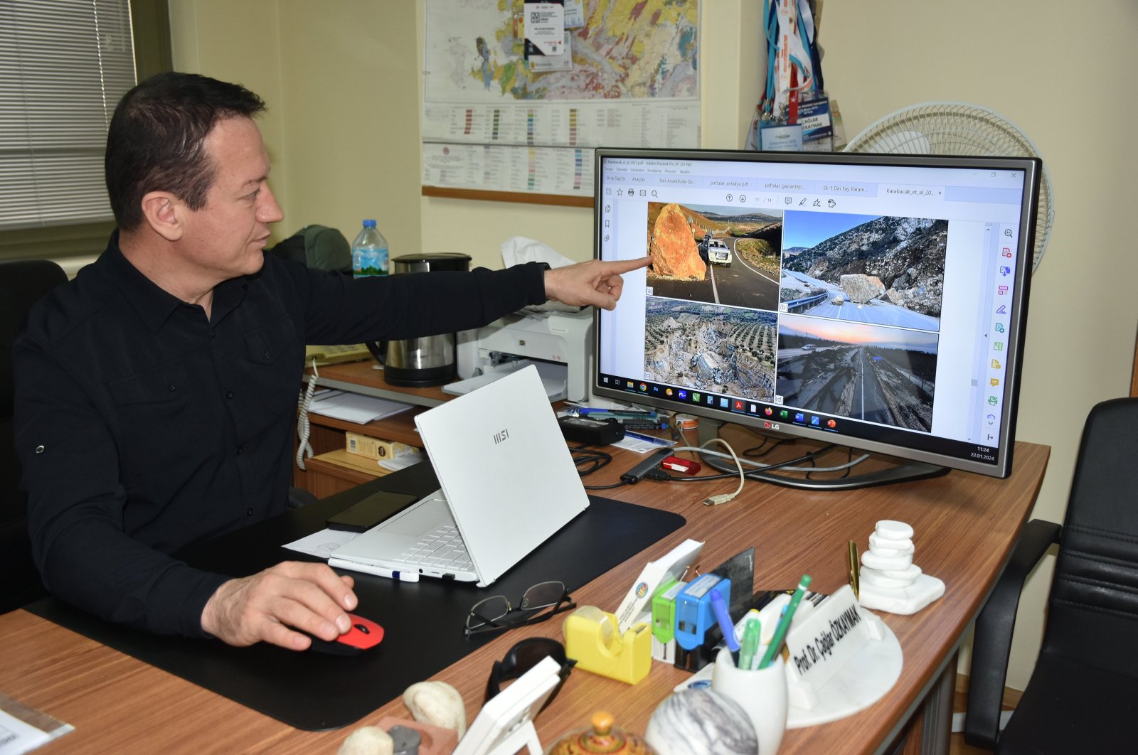 Çağlar Özkaymak, director of Afyon Kocatepe University&#039;s Earthquake Application and Research Center, explains fault lines, Hatay, Türkiye, Feb. 4, 2024. (AA Photo)