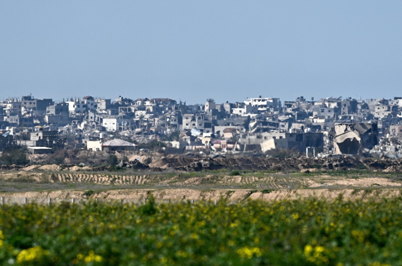 Israeli tanks maneuver inside Gaza near buildings destroyed by Israel&#039;s strikes, amid the ongoing conflict, as seen from Israel, Feb. 4, 2024. (Reuters Photo)