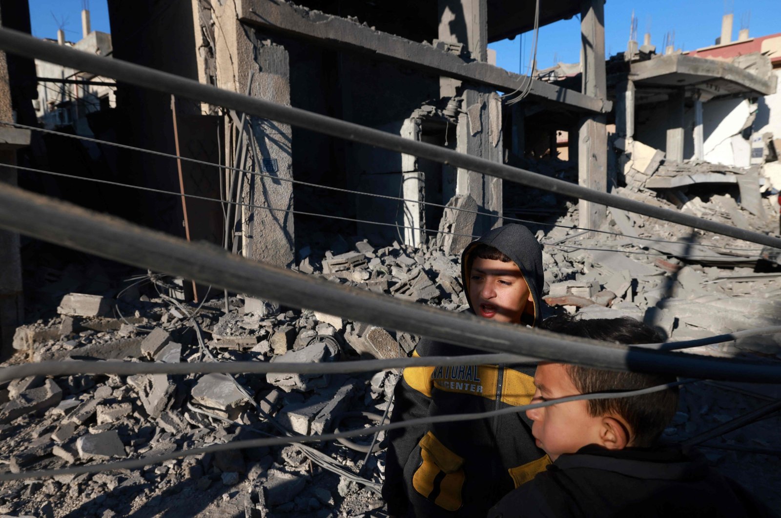 Children check the devastation in the aftermath of Israeli bombardment on Rafah, southern Gaza, Palestine, Feb. 4, 2024. (AFP Photo)