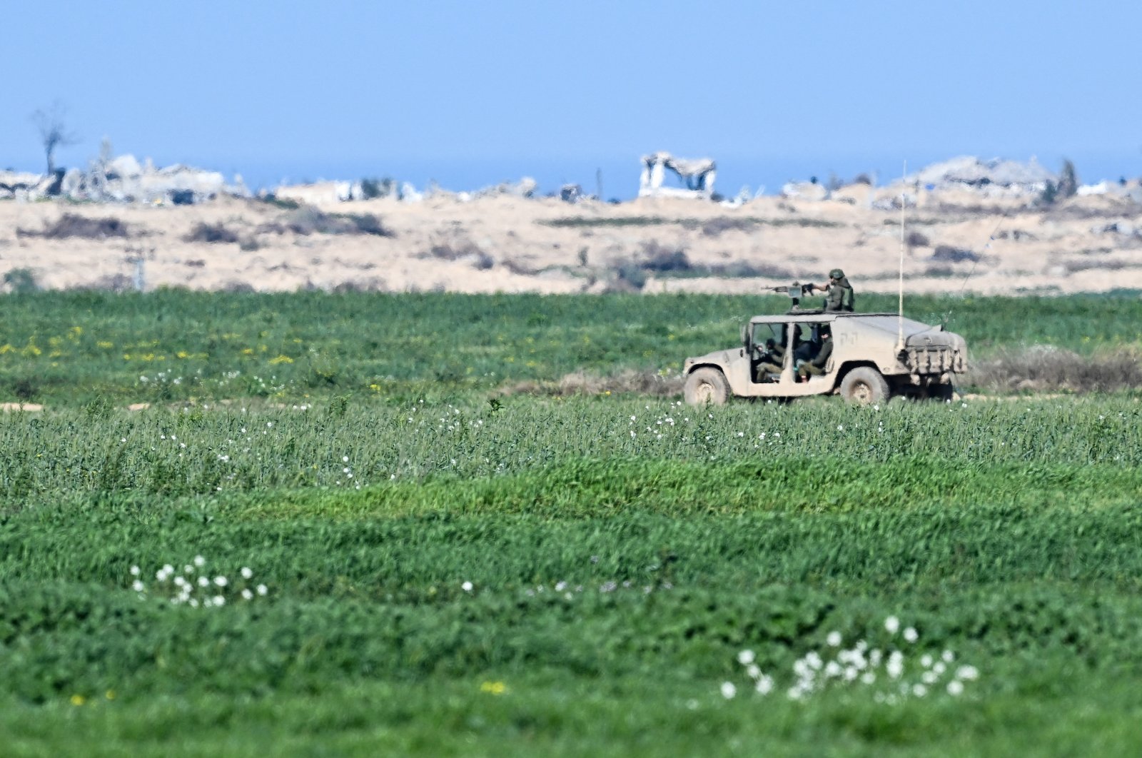 A military vehicle passes near the Israel-Gaza border, Feb. 4, 2024. (Reuters Photo)