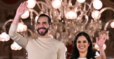 TOPSHOT - Salvadoran President Nayib Bukele greets supporters next to his wife Gabriela Rodriguez after the presidential and legislative elections in San Salvador on February 4, 2024. Fireworks erupted in El Salvador's capital as gang-busting President Nayib Bukele claimed to have won reelection with more than 85 percent of votes cast: "a record in the entire democratic history of the world." (Photo by Marvin RECINOS / AFP)