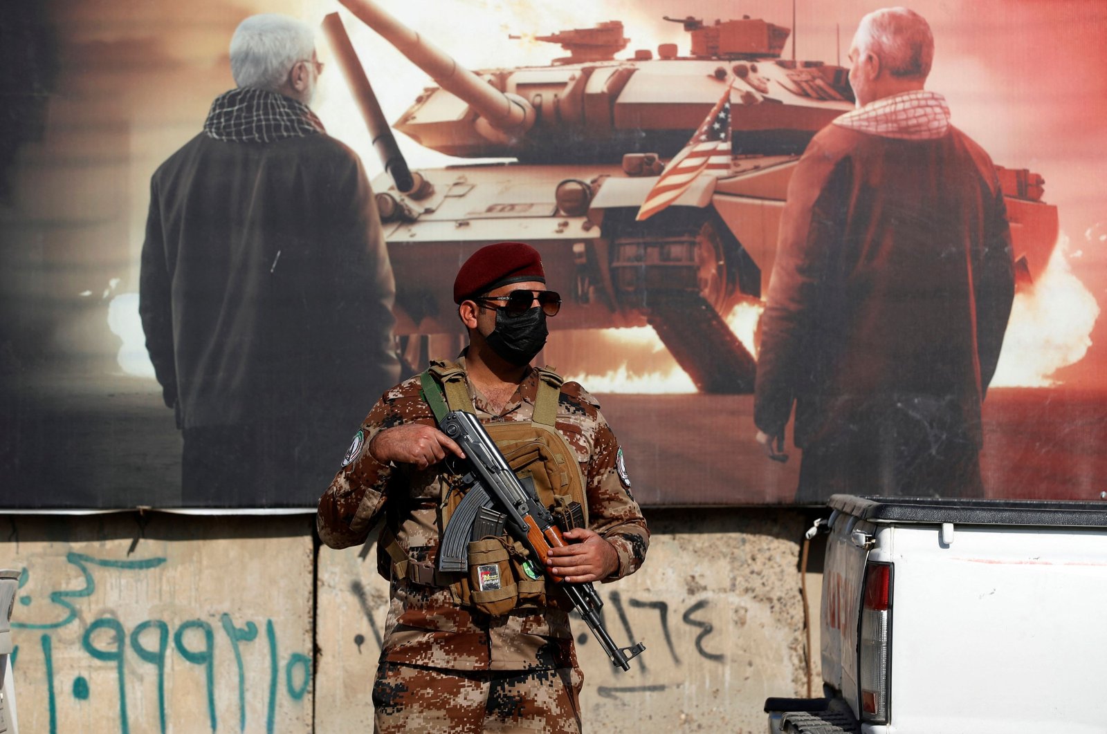 A paramilitary of the Hashd al-Shaabi (Popular Mobilization) forces stands guard during the funeral of a comrade, who died in American airstrikes, Baghdad, Iraq, Jan. 25, 2024. (AFP Photo)