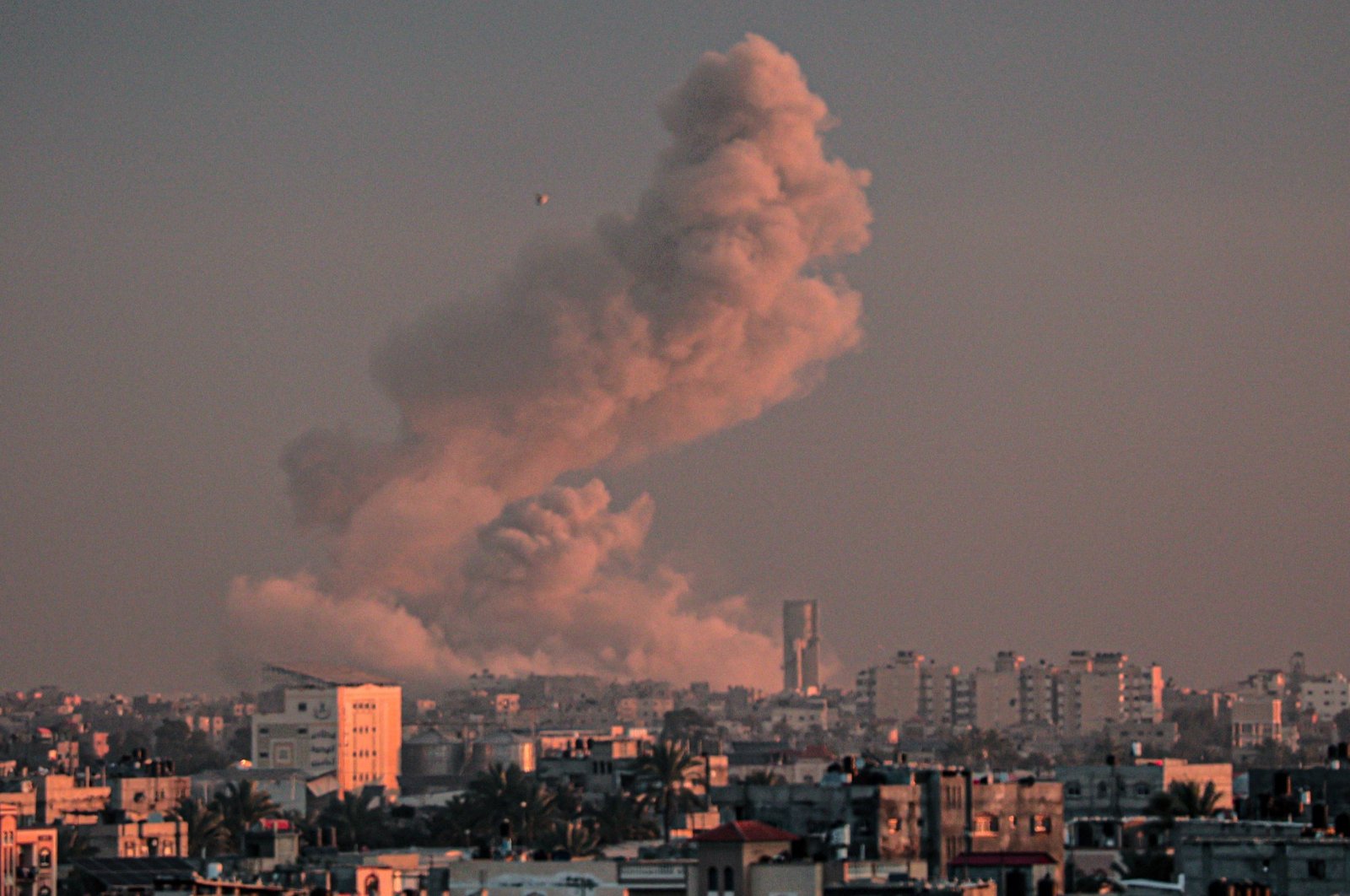 A picture taken from Rafah in the southern Gaza Strip shows smoke rising over buildings in Khan Younis following Israeli bombardment, Palestine, Feb. 5, 2024. (AFP Photo)