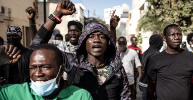 Protesters gesture after police fired teargas at them outside the General Assembly in Dakar, Senegal, Feb. 5, 2024. (AFP Photo)