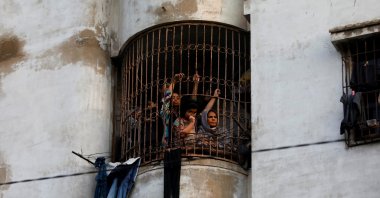 Residents watch an election campaign rally in Karachi, Pakistan, Feb. 5, 2024. (Reuters Photo)
