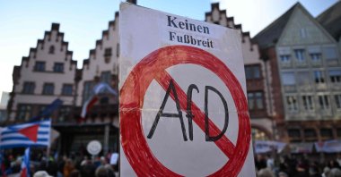 A sign reading &quot;not yield an inch for AfD (Alternative für Deutschland)&quot; is held during a demonstration against racism and far-right politics in Frankfurt am Main on Feb. 5, 2024. (AFP Photo)