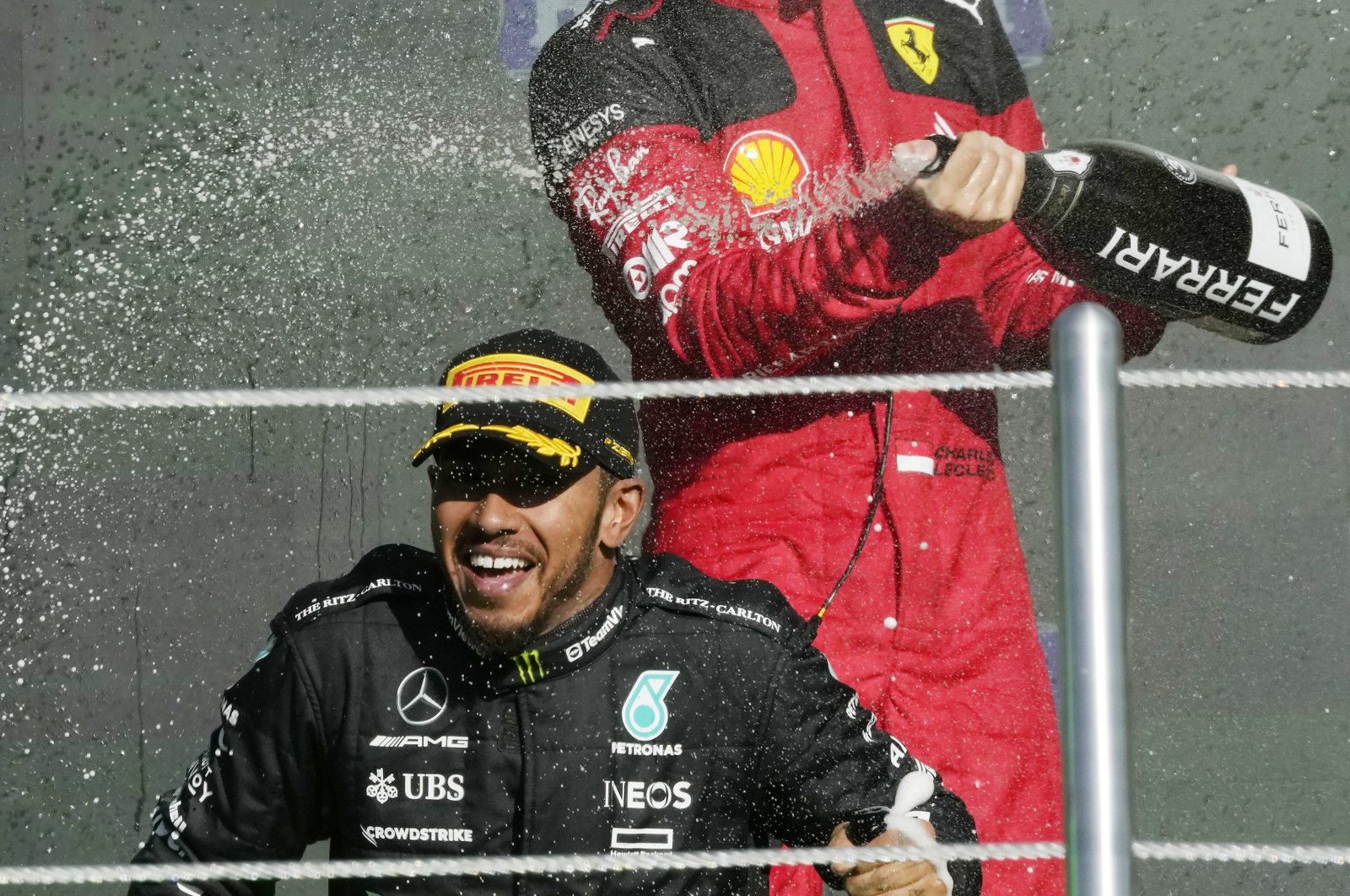 Mercedes driver Lewis Hamilton (C) and Ferrari driver Charles Leclerc of Monaco celebrate on the podium for the Formula One Mexico Grand Prix, Hermanos Rodriguez racetrack, Mexico City, Mexico, Oct. 29, 2023. (AP Photo)