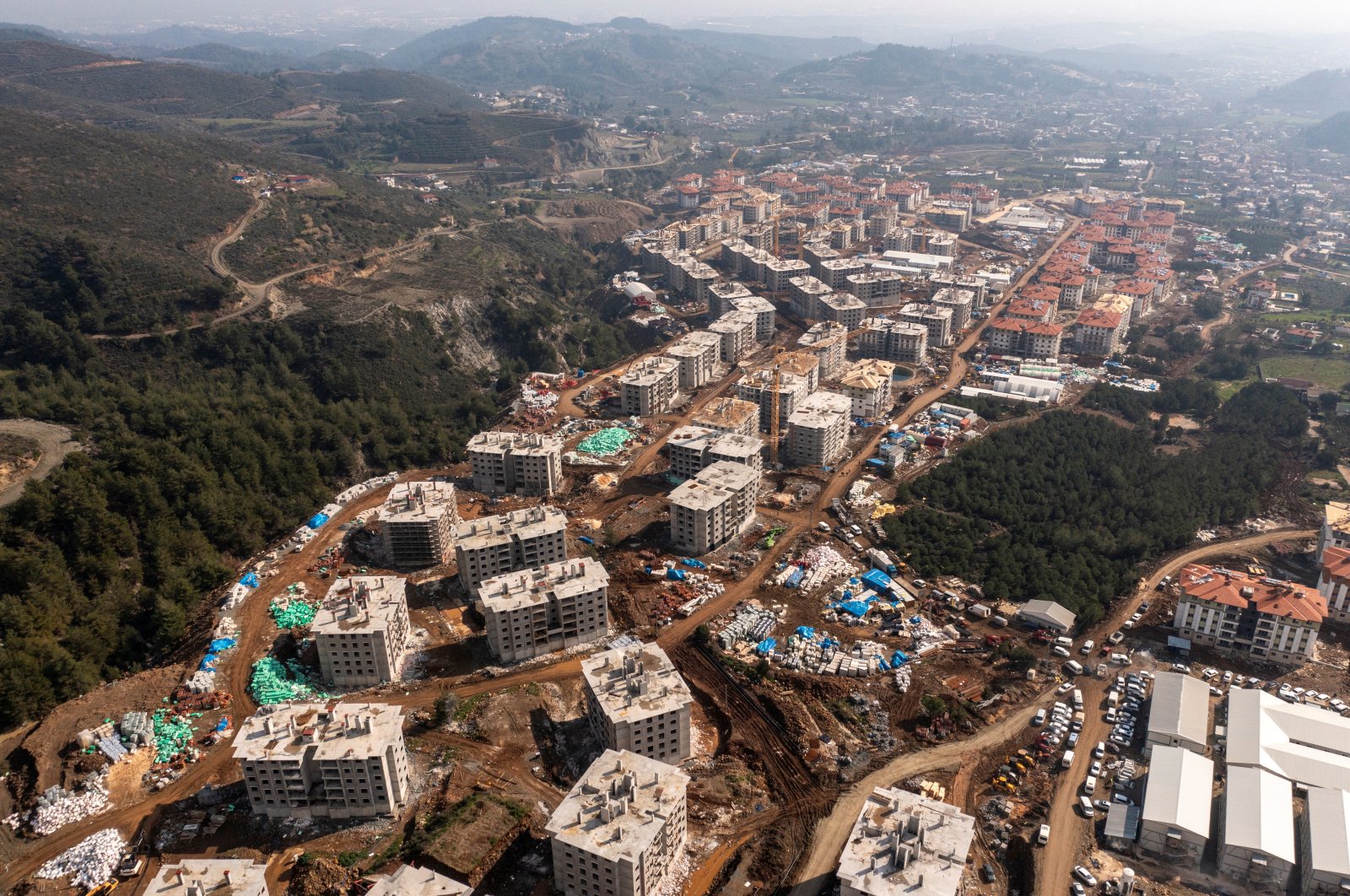 An aerial view shows new residential buildings being constructed for people left homeless after last year&#039;s devastating earthquake in Hatay province, Türkiye, Feb. 2, 2024. (Reuters Photo)