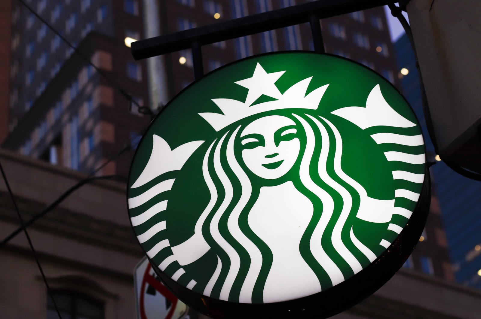 A Starbucks sign is seen outside a Starbucks coffee shop in downtown Pittsburgh, Ontario, Canada, June 26, 2019. (AP Photo)