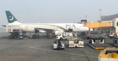A view of a Pakistan International Airlines (PIA) passenger plane, taken through a glass panel, at the Allama Iqbal International Airport, Lahore, Pakistan Jan. 29, 2024. (Reuters Photo)