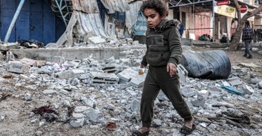A girl walks through rubble in an area hit by Israeli bombardment, in Rafah, Gaza, Palestine, Feb. 7, 2024. (AFP Photo)
