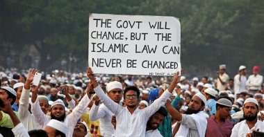 A man holds a banner during a rally organized by All India Muslim Personal Law Board (AIMPLB), in support of the Muslim Personal Law against what they say is the central government&#039;s move to change it and impose the Uniform Civil Code across the country, in Kolkata, India, Nov. 20, 2016. (Reuters File Photo)