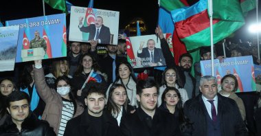 Supporters of Ilham Aliyev, Azerbaijan&amp;#039;s incumbent President and a candidate for the Azerbaijani presidential elections, celebrate in a street following the announcement of exit poll results in Baku, Azerbaijan, Feb. 7, 2024. (Reuters Photo)