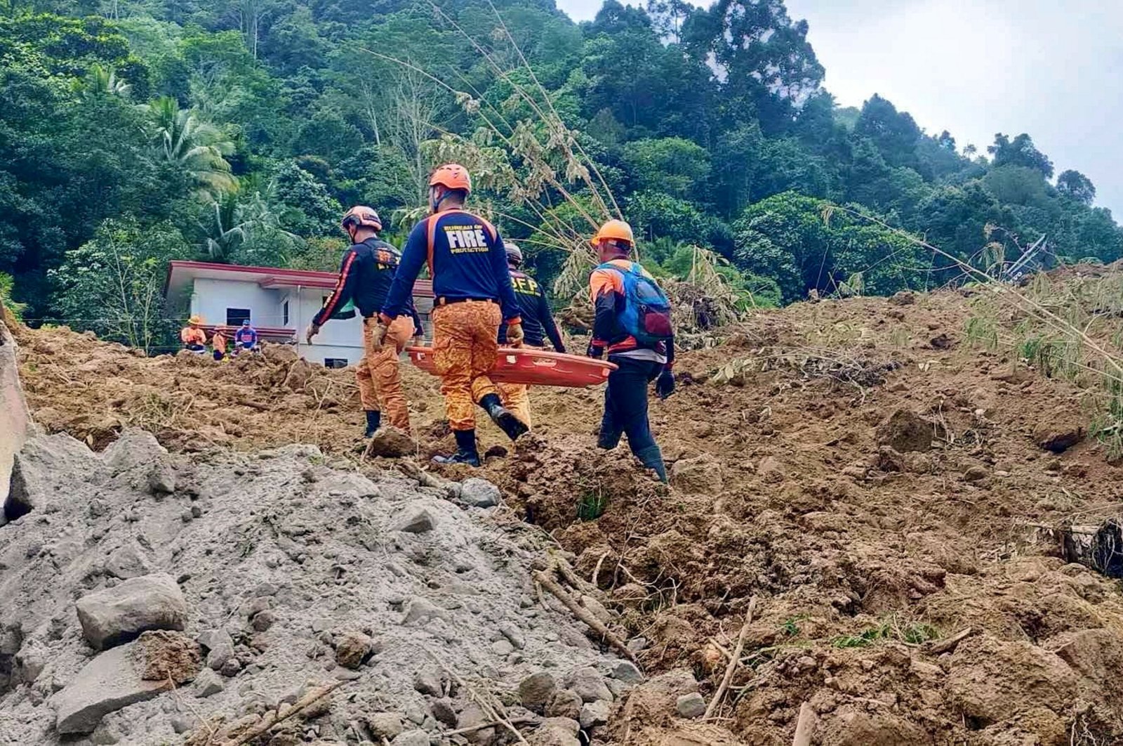 A handout photo provided by the Bureau of Fire Protection (BFP) shows rescuers working as they continue a search operation at a landslide-hit village in the town of Maco, Davao de Oro province, Philippines, Feb. 7, 2024. (EPA Photo)