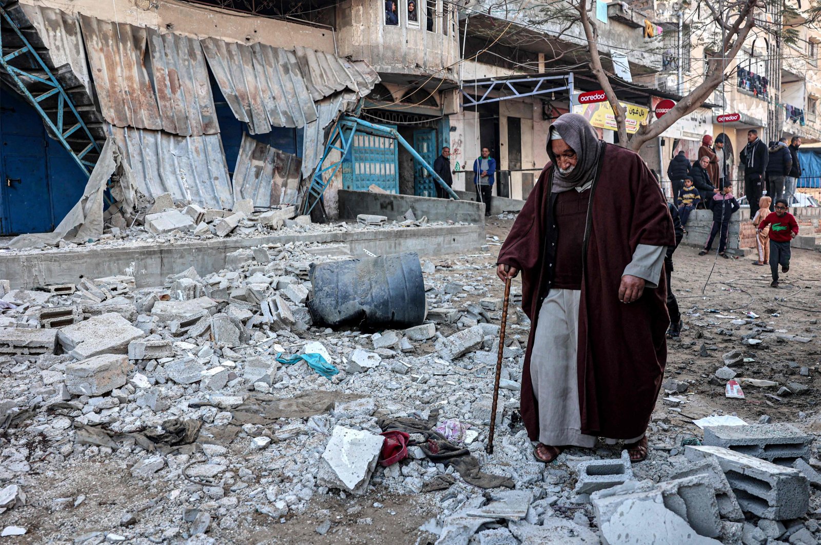 An elderly man walks through rubble in an area hit by Israeli bombardment, Rafah, southern Gaza Strip, Palestine, Feb. 7, 2024. (AFP Photo)