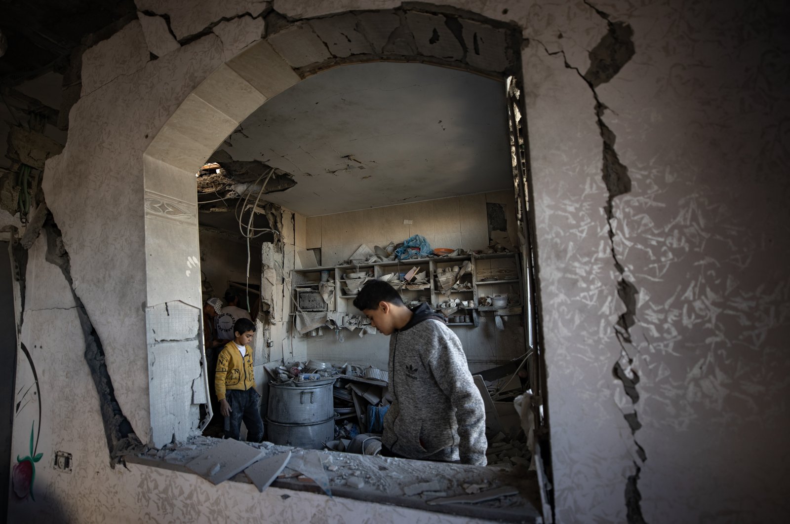 A Palestinian inspects his damaged family house following overnight Israeli airstrikes, Rafah, southern Gaza, Feb. 7, 2024. (EPA Photo)