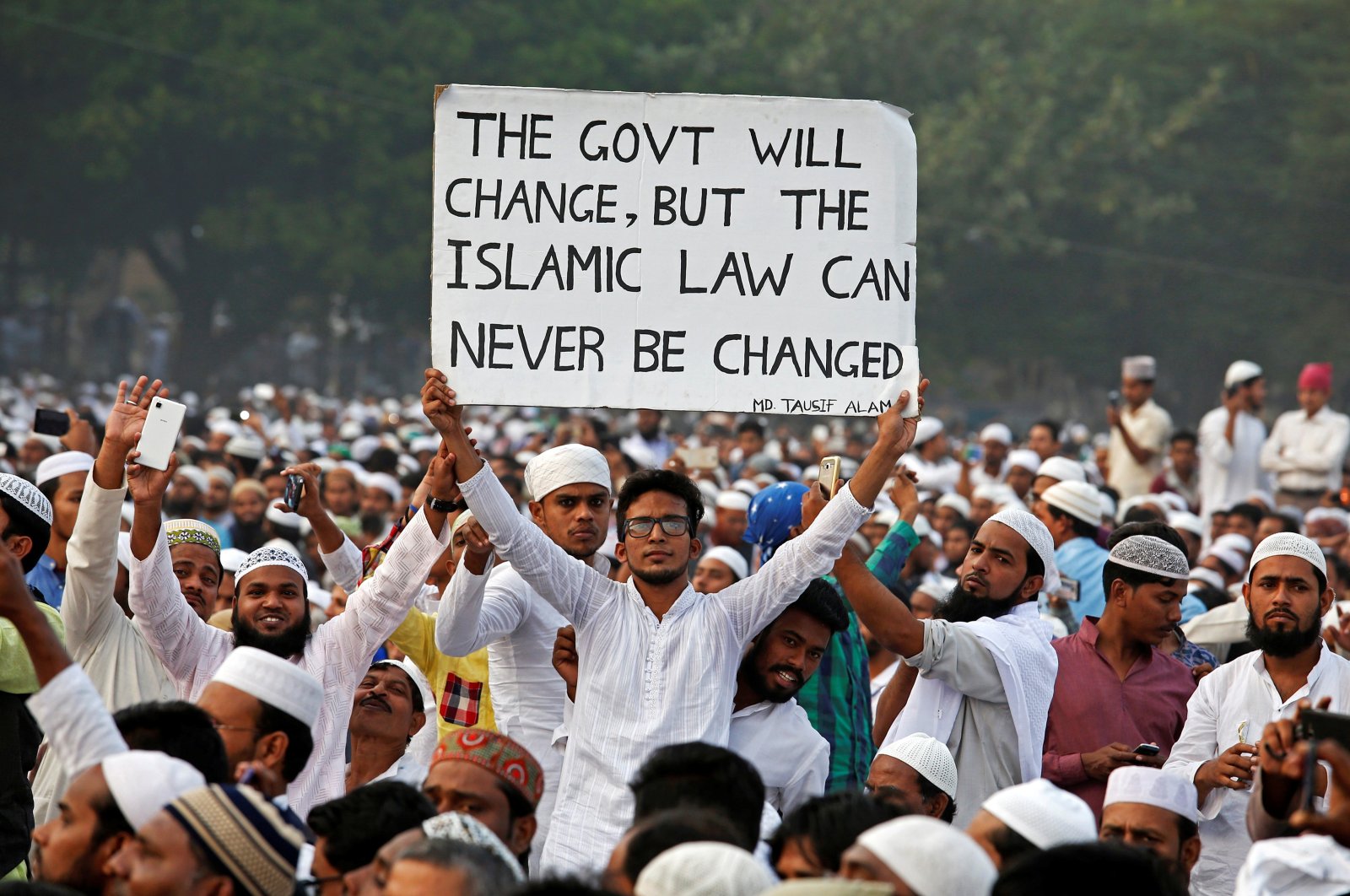 A man holds a banner during a rally organized by All India Muslim Personal Law Board (AIMPLB), in support of the Muslim Personal Law against what they say is the central government&#039;s move to change it and impose the Uniform Civil Code across the country, in Kolkata, India, Nov. 20, 2016. (Reuters File Photo)