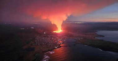 A volcano spews lava and smoke as it erupts in Reykjanes Peninsula, Iceland, Feb. 8, 2024.