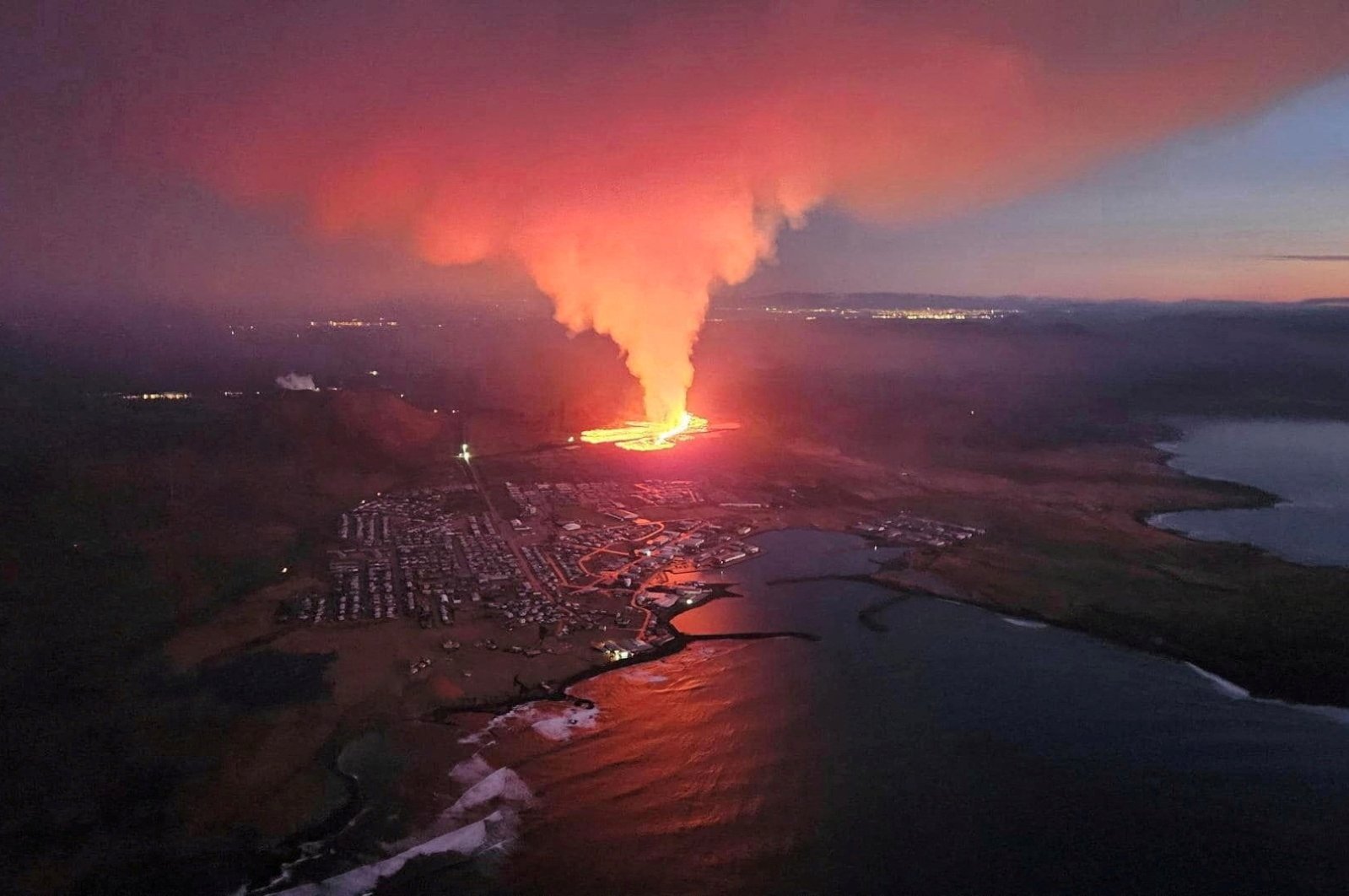 A volcano spews lava and smoke as it erupts in Reykjanes Peninsula, Iceland, Feb. 8, 2024.