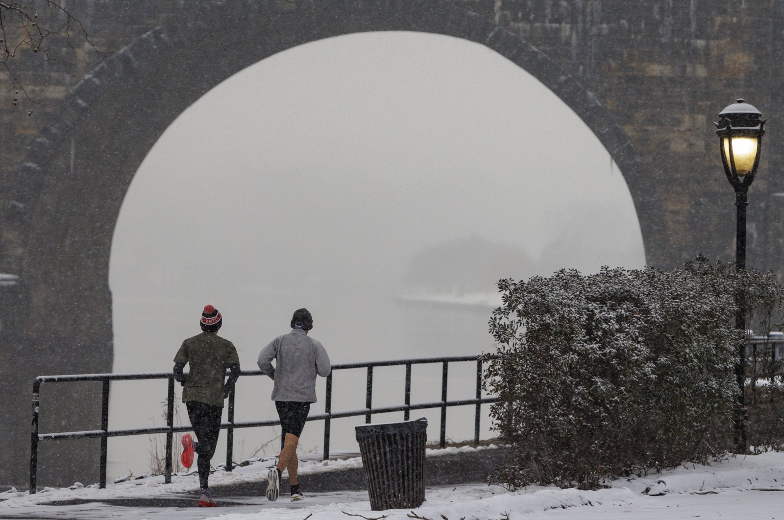 Joggers run along Kelly Drive in Philadelphia, Pennsylvania, U.S., Jan. 19, 2024. (AP Photo)