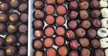 Chocolate truffles are prepared and packaged at an artisanal chocolate shop and cafe in Chicago, Illinois, U.S. Cocoa prices have surged over the past several years, recently reaching near-record levels and driving up the cost of chocolate, Feb. 2, 2024. (AFP Photo)