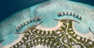 Rare dreamy beach islands are in high demand, to meet this, the travel industry is creating artificial paradises worldwide, like the half-moon bays at Patina Maldives Resort. (dpa Photo)