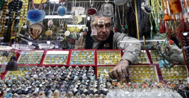 A ring seller and manufacturer displays stone rings in his shop at the old bazaar in the city of Shahr-e Ray (Rey), south of Tehran, Iran, Jan. 8, 2024. (AFP Photo)