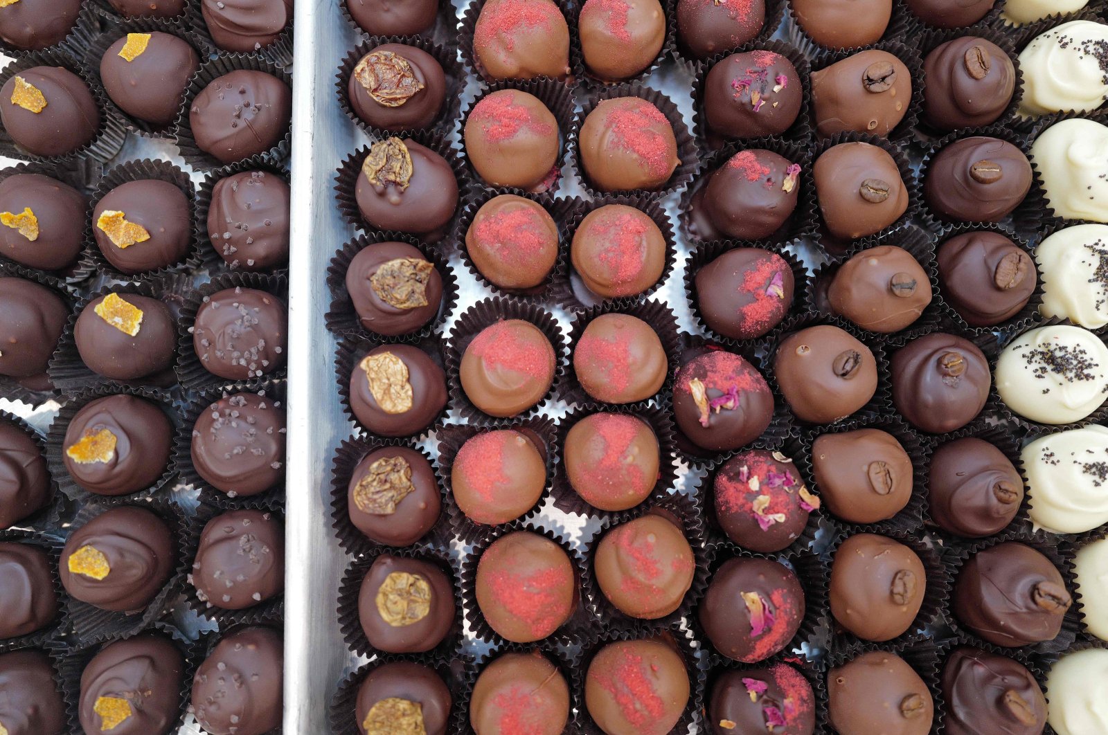 Chocolate truffles are prepared and packaged at an artisanal chocolate shop and cafe in Chicago, Illinois, U.S. Cocoa prices have surged over the past several years, recently reaching near-record levels and driving up the cost of chocolate, Feb. 2, 2024. (AFP Photo)