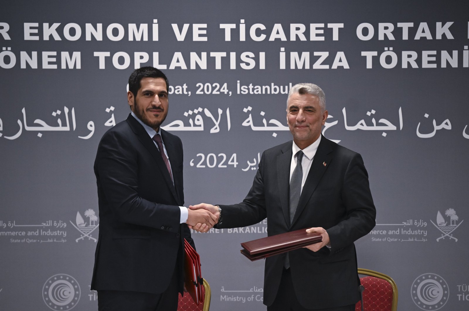 Trade Minister Ömer Bolat (R) shakes hands with Qatari Commerce and Industry Minister Sheikh Mohammed bin Hamad Al Thani after signing the JETCO Protocol, Istanbul, Türkiye, Feb. 8, 2024. (AA Photo)