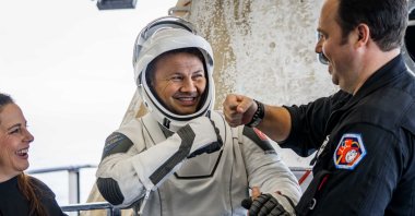 Alper Gezeravcı, Türkiye's first astronaut, is accompanied out of the SpaceX Dragon spacecraft carrying the Ax-3 crew after it splashed down off the coast of Daytona, Florida, U.S., Feb. 9, 2024. (Courtesy of Axiom Space)