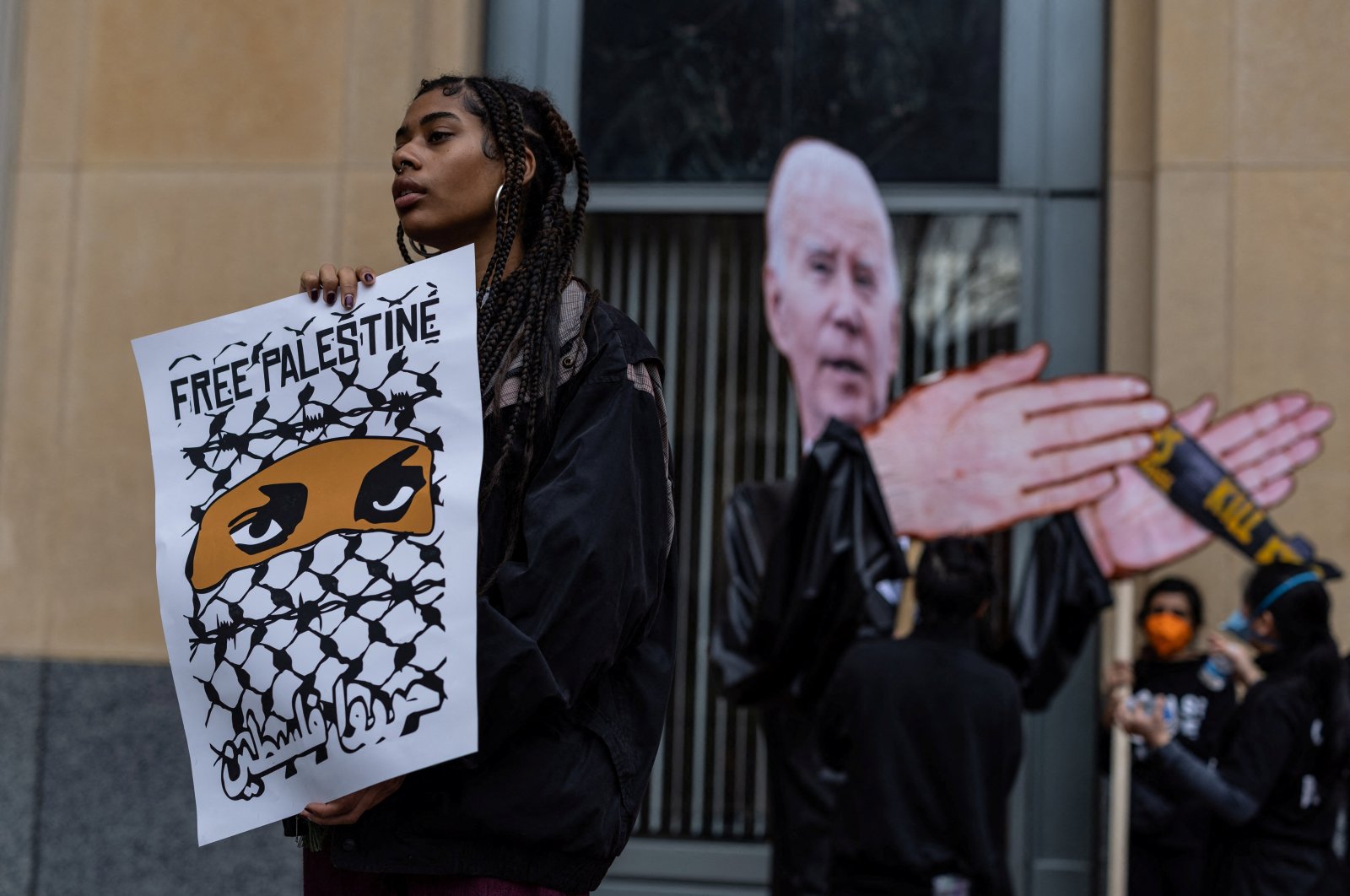 People attend a protest outside of a federal court building where members of the Palestinian community present oral argument in a lawsuit filed against U.S. President Joe Biden, U.S. Secretary of State Antony Blinken and U.S. Secretary of Defense Lloyd Austin seeking an emergency order halting U.S. support for Israel, in Oakland, California, U.S., Jan. 26, 2024. (Reuters Photo)