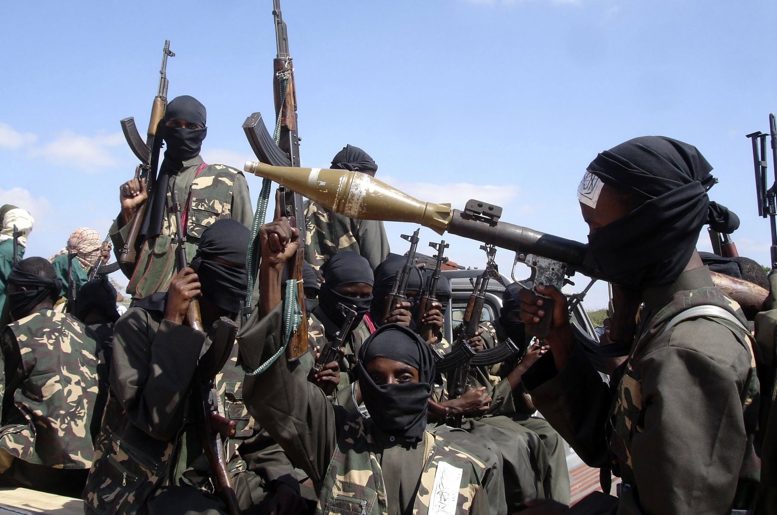 Armed al-Shabab fighters seen near Mogadishu, Somalia, Dec. 8, 2008. (AP Photo)