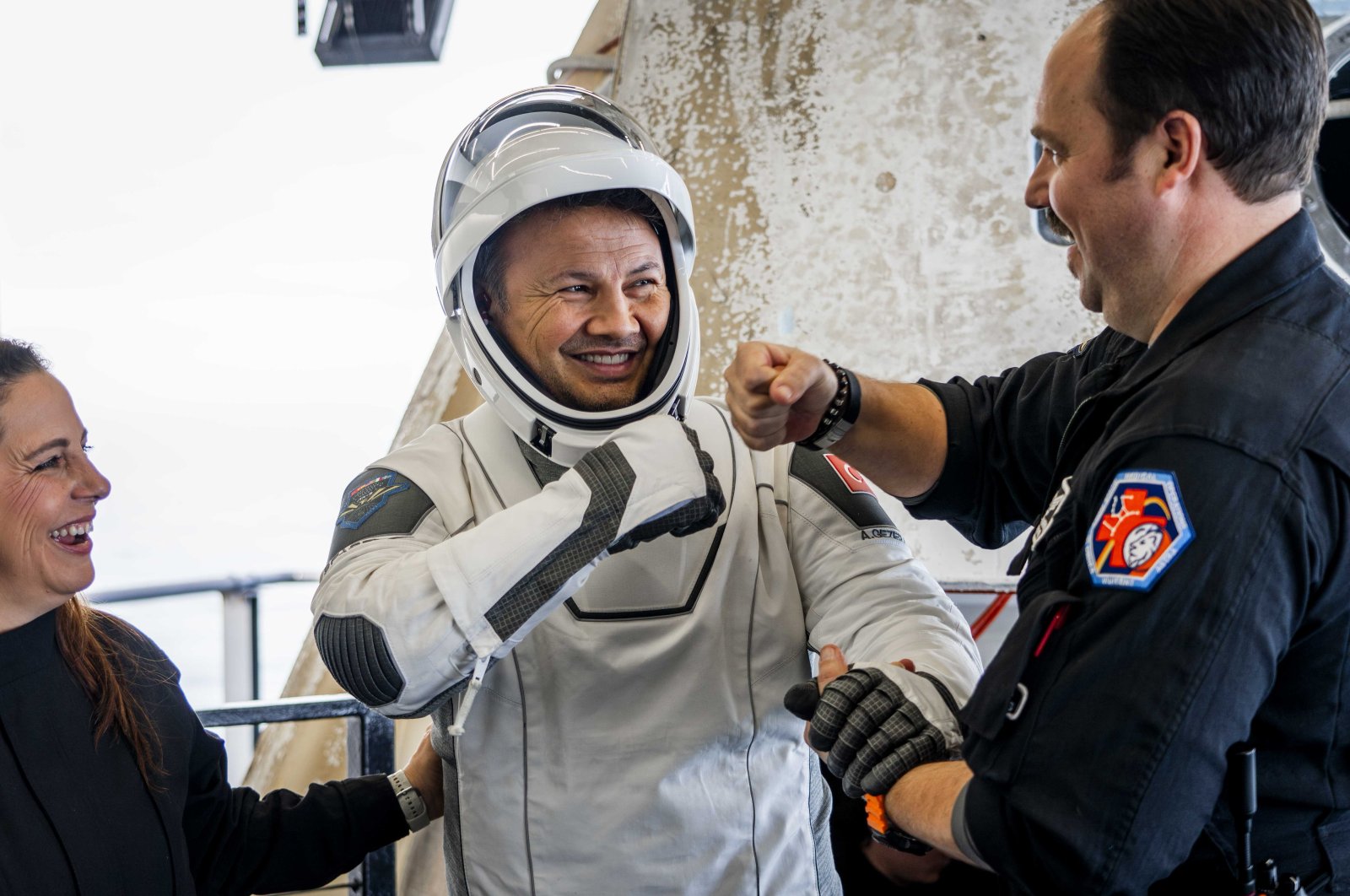 Alper Gezeravcı, Türkiye&#039;s first astronaut, is accompanied out of the SpaceX Dragon spacecraft carrying the Ax-3 crew after it splashed down off the coast of Daytona, Florida, U.S., Feb. 9, 2024. (Courtesy of Axiom Space)