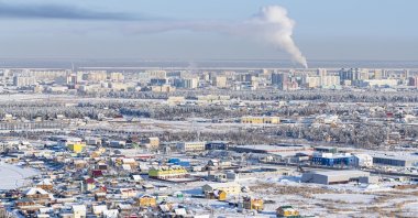 In Russia's Far East, laborers endure bitter cold and extreme conditions to maintain hulking vessels encased in ice during the grueling "vymorozka" process. (Getty Images Photo)