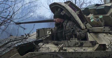 A Ukrainian serviceman prepares for combat on a Bradley fighting vehicle near Avdiivka, Donetsk, Ukraine, Feb. 11, 2024. (AFP Photo)