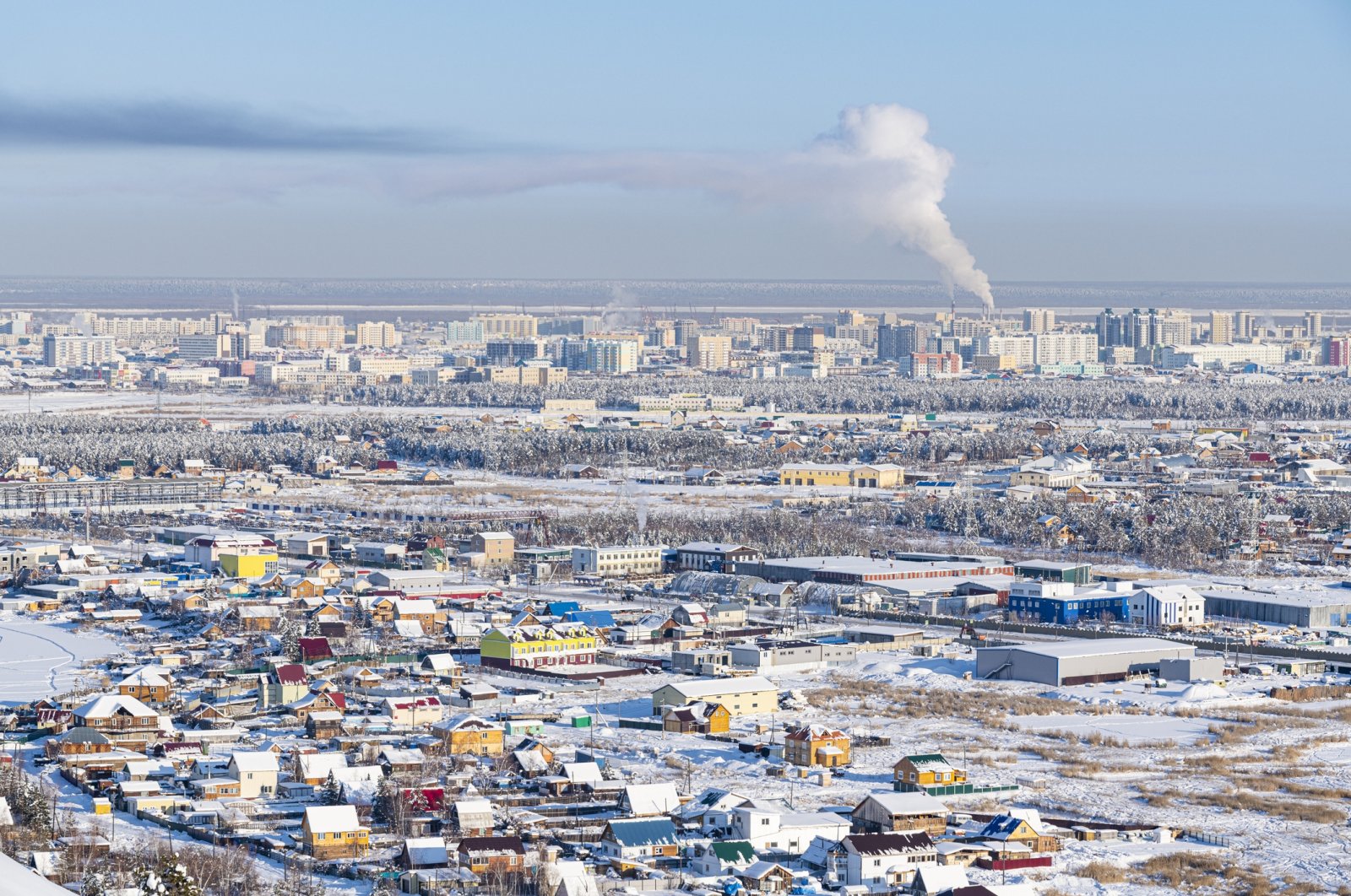 In Russia&#039;s Far East, laborers endure bitter cold and extreme conditions to maintain hulking vessels encased in ice during the grueling &quot;vymorozka&quot; process. (Getty Images Photo)