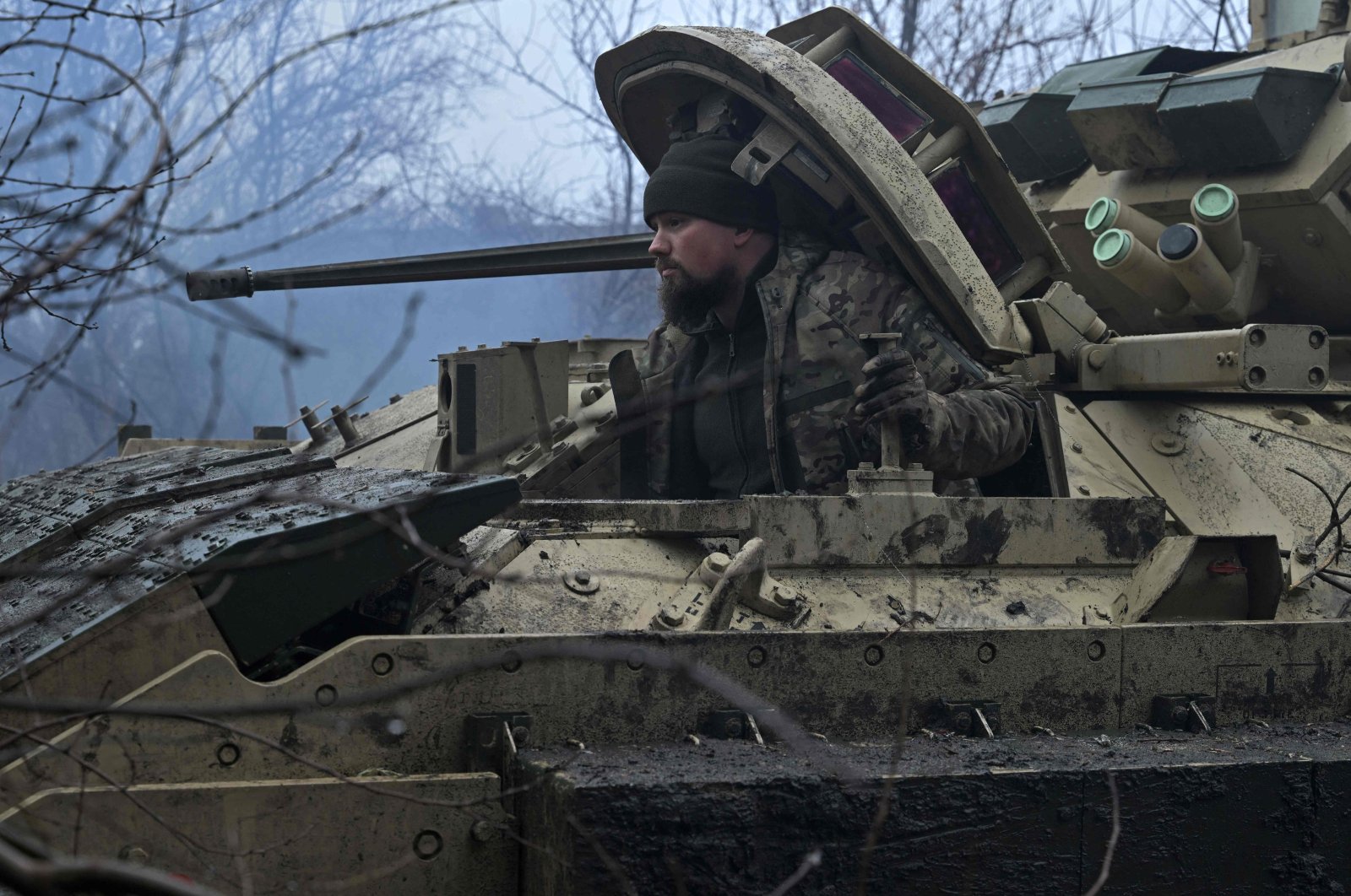 A Ukrainian serviceman prepares for combat on a Bradley fighting vehicle near Avdiivka, Donetsk, Ukraine, Feb. 11, 2024. (AFP Photo)