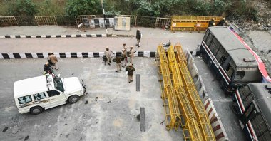 Security personnel stand guard at a road block during a nationwide strike called by farmers, along the Ghazipur New Delhi-Uttar Pradesh state border, India, Feb. 13, 2024. (AFP Photo)