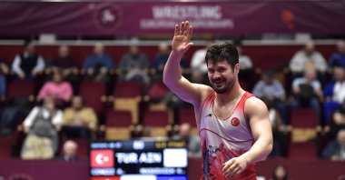 Turkish wrestler Ali Cengiz waves after beating Kiryl Maskevich at the European Wrestling Championships, Bucharest, Romania, Feb. 12, 2024. (AA Photo)
