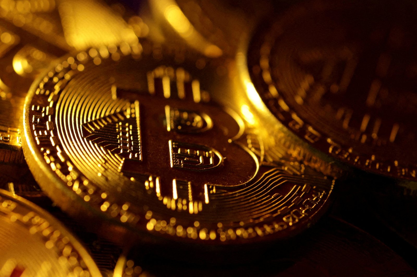 This illustration shows physical representations of the Bitcoin cryptocurrency, Oct. 24, 2023. (Reuters Photo)