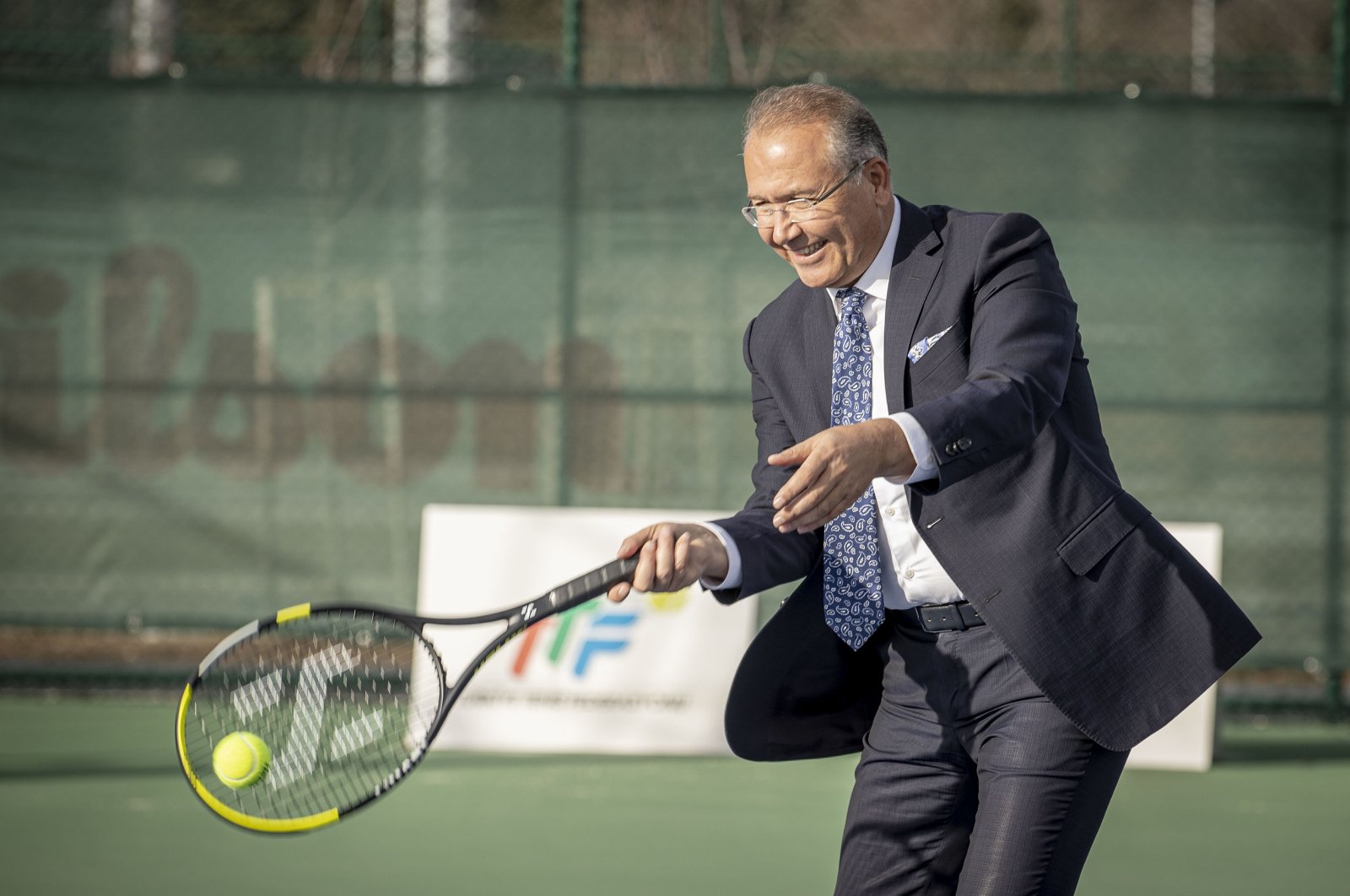 Turkish Tennis Federation (TTF) President Cengiz Durmuş hits a ball after an interview, Ankara, Türkiye, Feb. 8, 2024. (AA Photo)