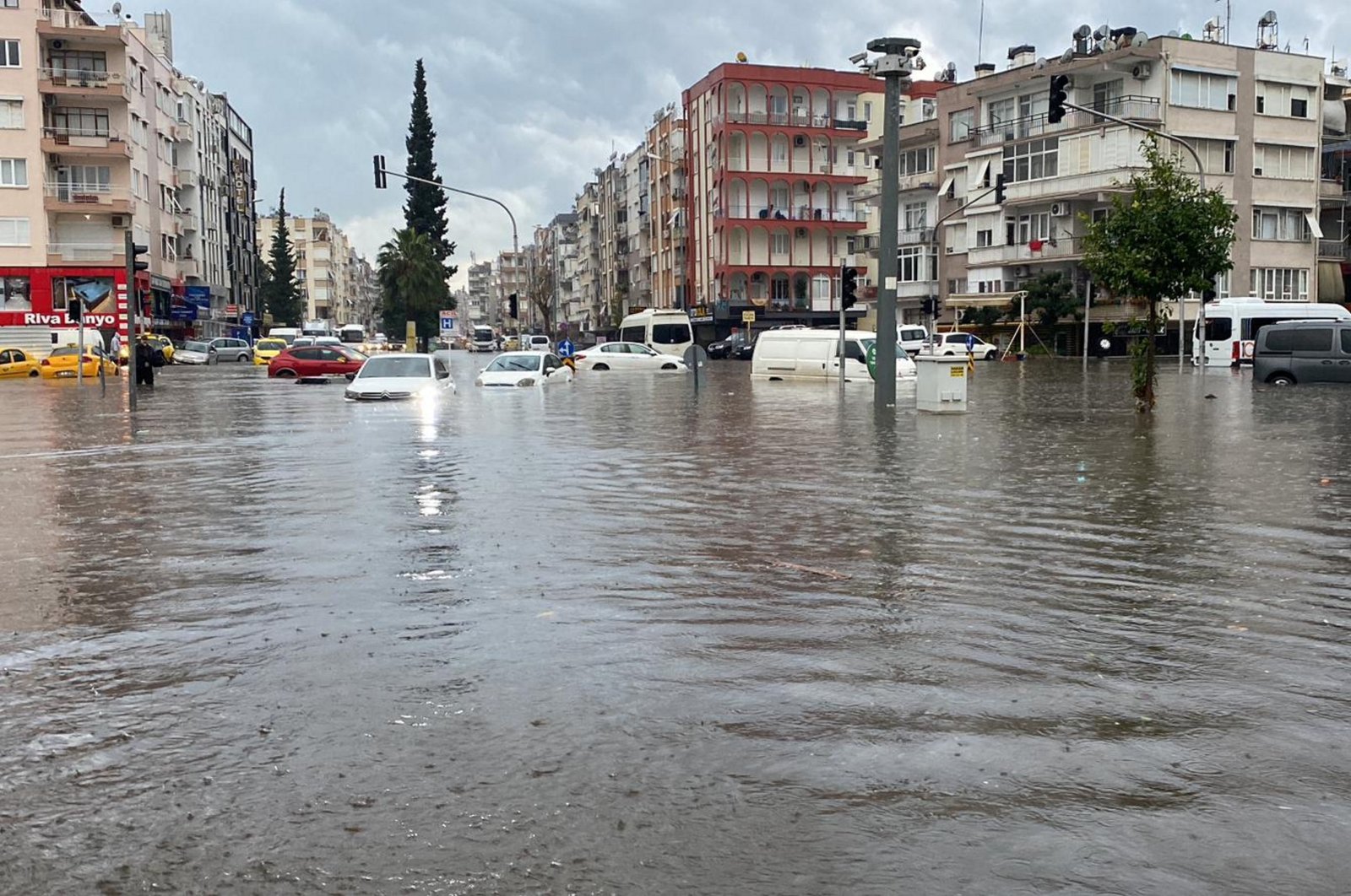 Cars sit in a flooded street caused by heavy rainfall in Antalya, southern Türkiye, Feb. 13, 2024. (AA Photo)